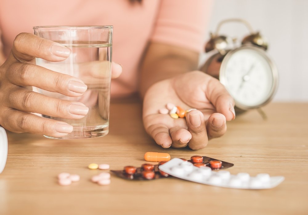 Close‑up of timing tablet blister packs next to a doctor’s prescription