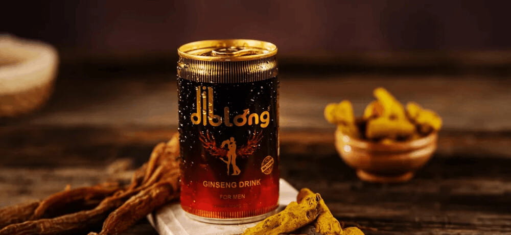 Diblong Energy Drink for Men with Natural Ginseng Extracts Diblong 150ml energy drink can placed on a wooden table with ginseng roots and natural ingredients in Pakistan.